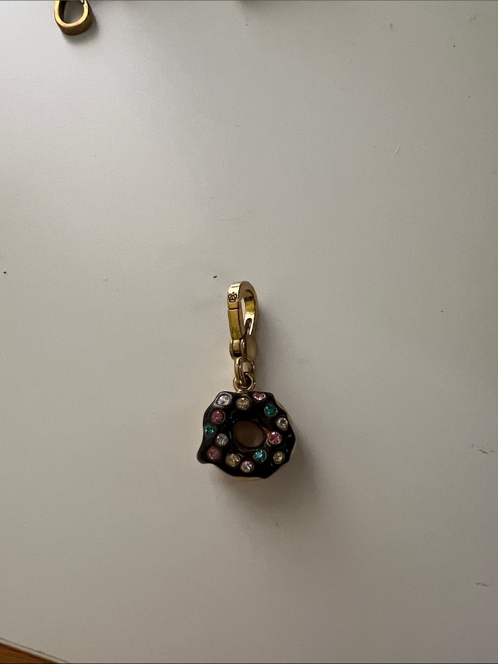 Juicy Couture Gold-Tone Donut Charm with Brown Enamel and Multi-Colored Gems